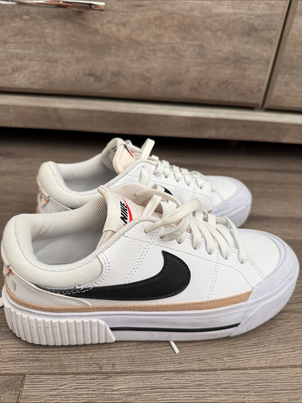 Nike White Sneakers with Black Swoosh and Tan Trim